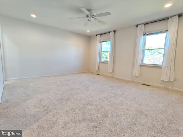 carpeted empty room with ceiling fan