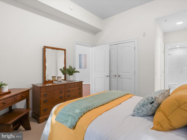 bedroom featuring a closet and carpet flooring