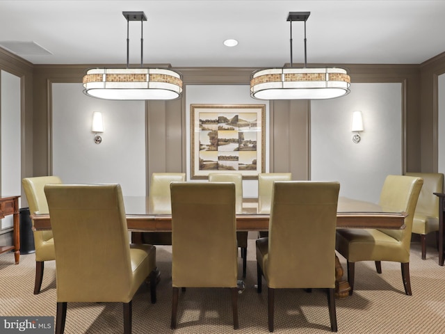 dining room with carpet flooring and ornamental molding