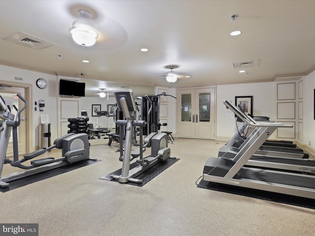 workout area featuring ceiling fan and ornamental molding