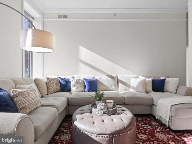 living room with ornamental molding