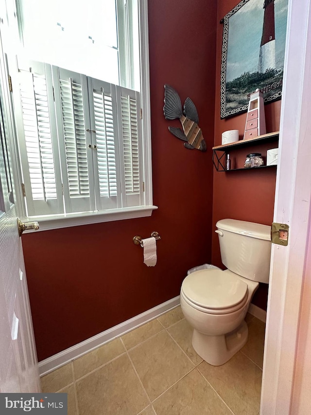 bathroom featuring toilet and tile patterned flooring