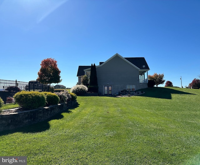 view of home's exterior featuring a lawn