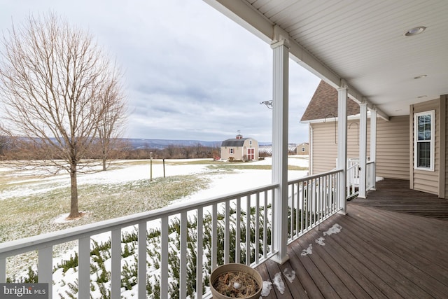 view of snow covered deck