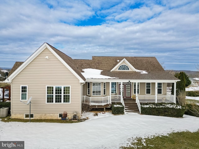 view of front of house featuring a porch and central AC unit