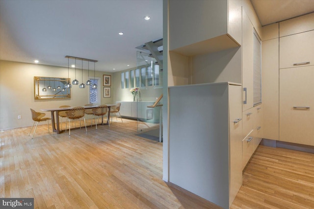 kitchen featuring light wood-type flooring, decorative light fixtures, and recessed lighting