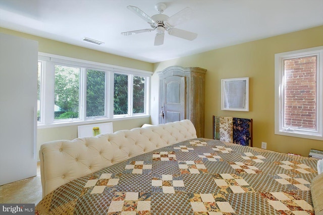 bedroom featuring visible vents and ceiling fan