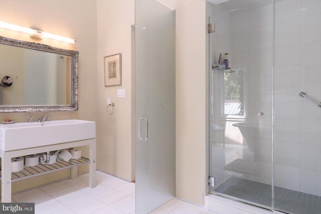 bathroom with tile patterned floors, a stall shower, and vanity