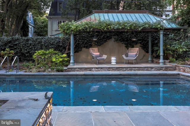 outdoor pool featuring a patio area
