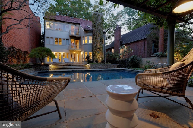 outdoor pool featuring a patio area