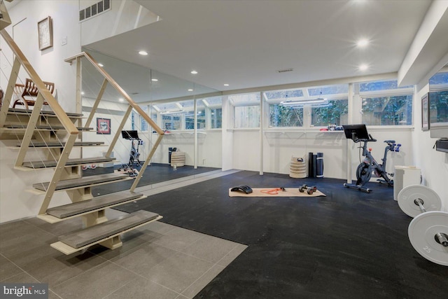 workout room featuring visible vents and recessed lighting