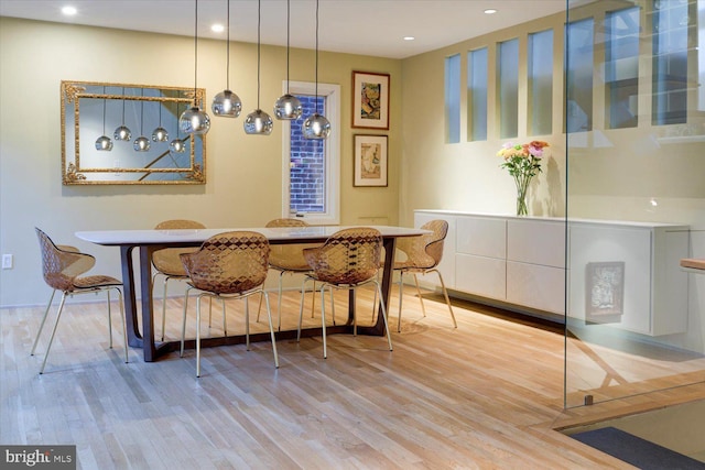 dining area with recessed lighting, wood finished floors, and breakfast area