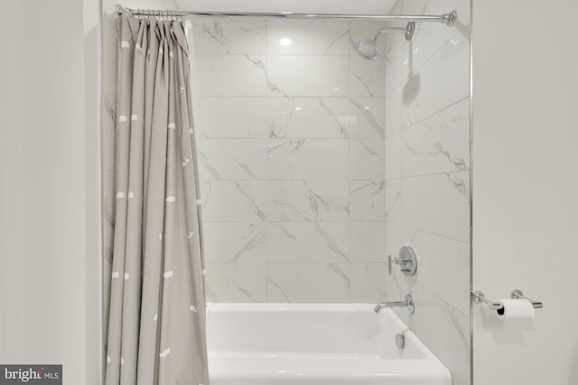 bathroom featuring shower / tub combo with curtain