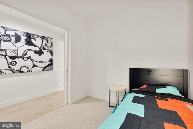 bedroom with wood-type flooring