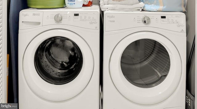 laundry room featuring washer and clothes dryer