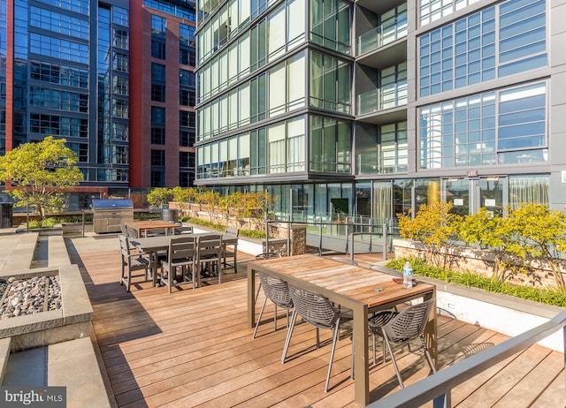 wooden deck featuring area for grilling