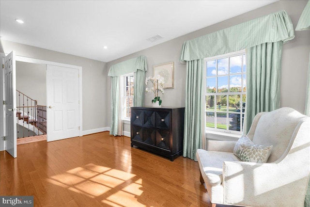 sitting room with hardwood / wood-style flooring