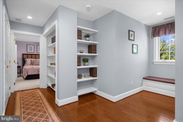 corridor featuring hardwood / wood-style flooring