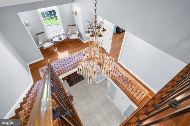 living room featuring a high ceiling and wood-type flooring