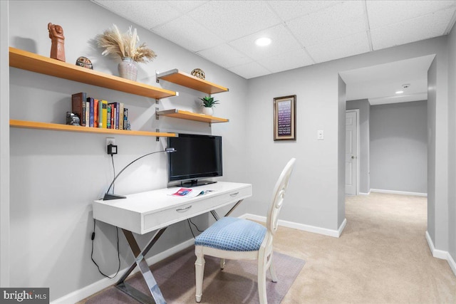 carpeted office featuring a drop ceiling