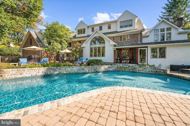 view of pool with a patio