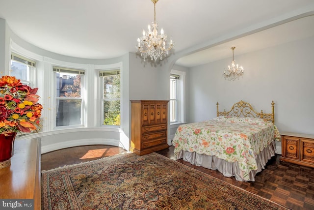 bedroom featuring an inviting chandelier