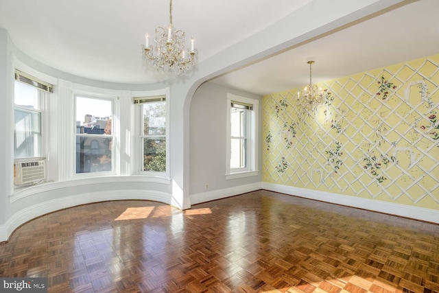 unfurnished dining area featuring cooling unit and dark parquet flooring