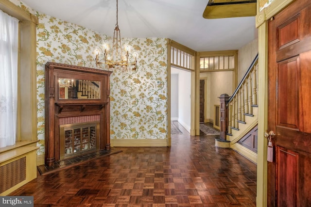 entrance foyer with dark parquet floors and plenty of natural light