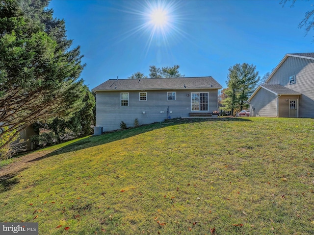 back of house featuring a yard