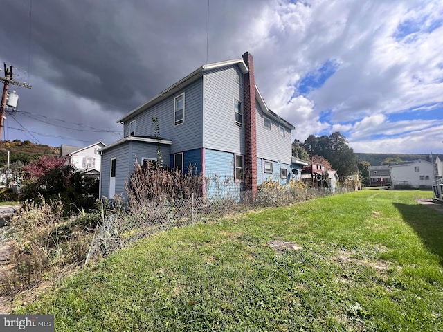 view of home's exterior featuring a lawn