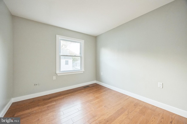 unfurnished room with light wood-type flooring