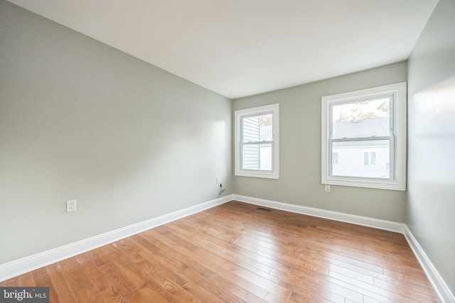 empty room with wood-type flooring