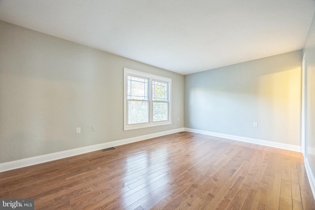 spare room featuring light hardwood / wood-style floors