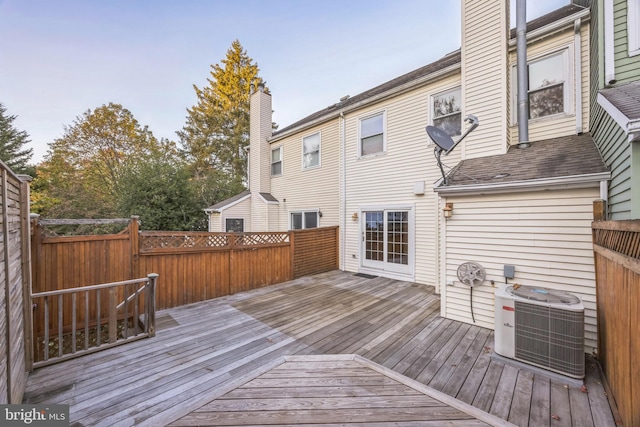 wooden terrace featuring central AC unit