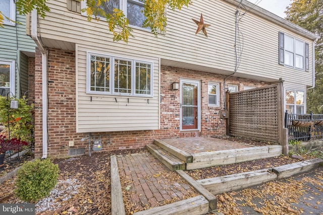 back of property with a patio