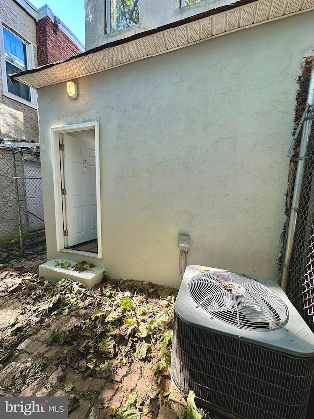 entrance to property featuring central air condition unit