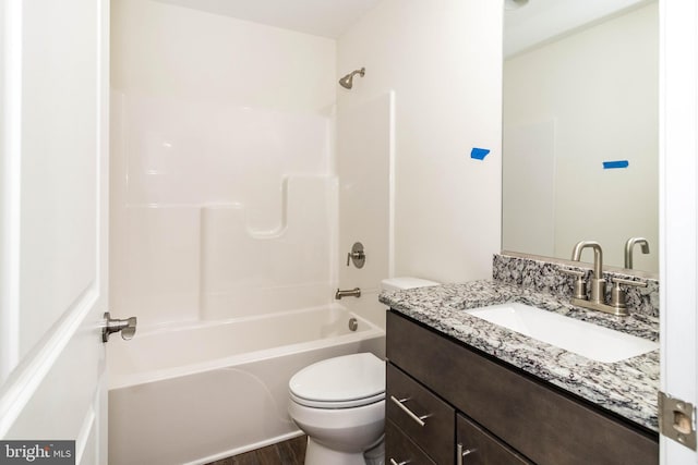 full bathroom with vanity, toilet, wood-type flooring, and shower / tub combination