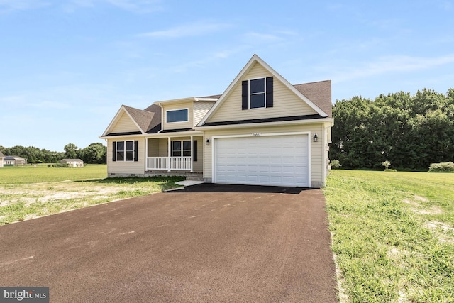 view of front of property featuring covered porch and a front lawn