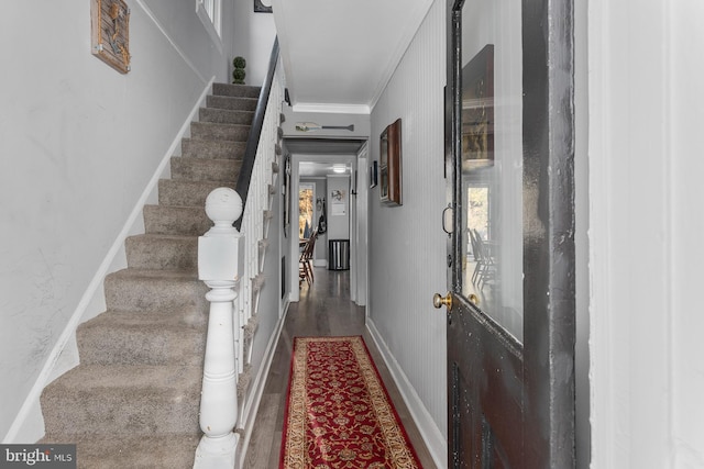 interior space with wood-type flooring and ornamental molding