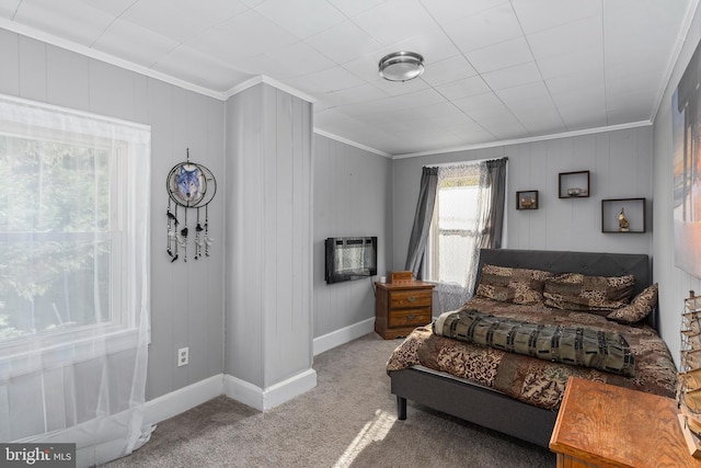 carpeted bedroom featuring ornamental molding and an AC wall unit