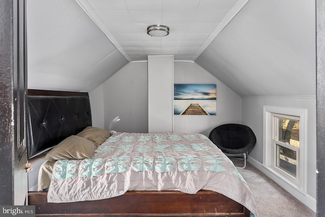 bedroom featuring carpet and lofted ceiling