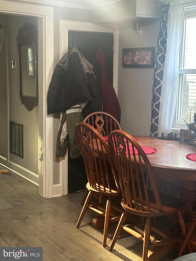 dining area with wood-type flooring