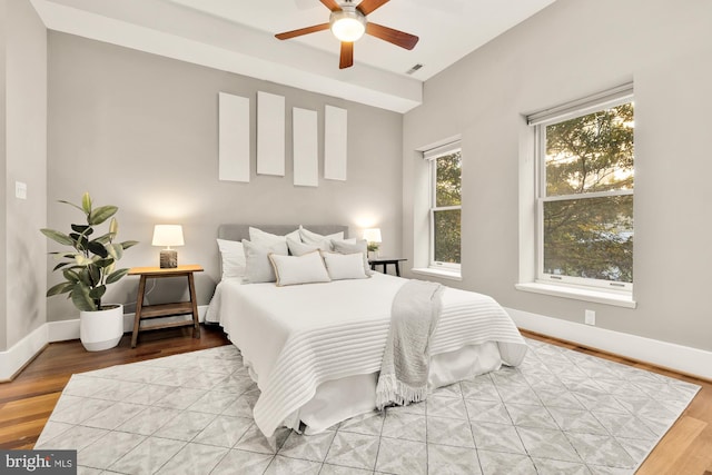 bedroom featuring hardwood / wood-style floors and ceiling fan