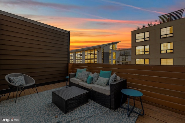 patio terrace at dusk featuring outdoor lounge area