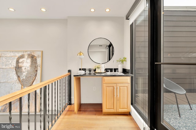 bathroom with vanity and hardwood / wood-style floors