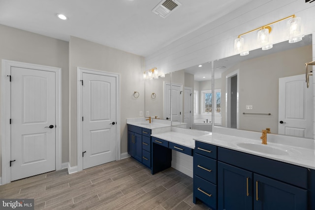 bathroom featuring vanity and hardwood / wood-style flooring