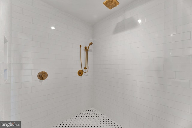 bathroom with a tile shower