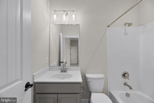 full bathroom featuring vanity, toilet, and tiled shower / bath combo