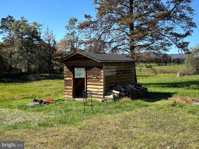 view of outdoor structure with a lawn