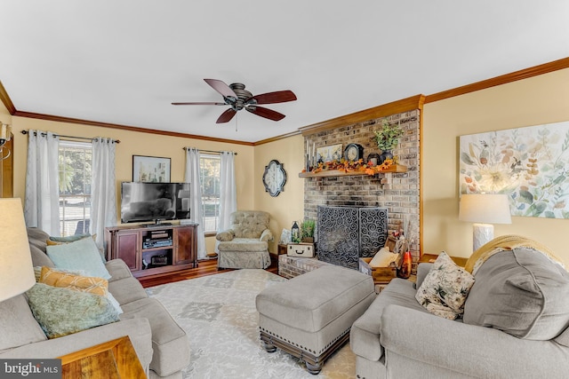 living room featuring ornamental molding, a fireplace, hardwood / wood-style flooring, and ceiling fan